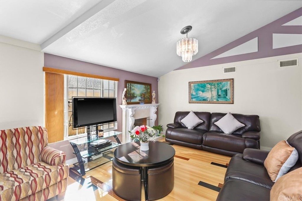 302 East 213th Street Carson, CA 90745 - Photo 4 of 41 a living room with furniture and a flat screen tv