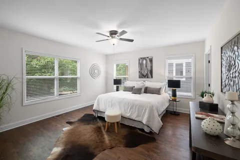 a bed room with a bed and a window