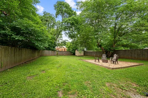 a view of backyard with a slide