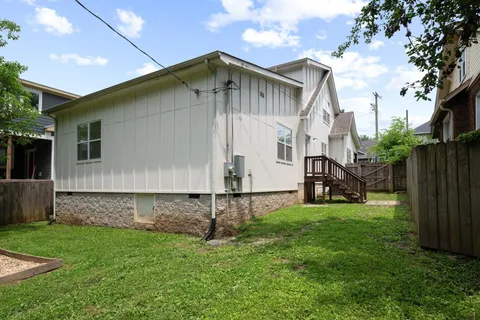 a front view of a house with yard