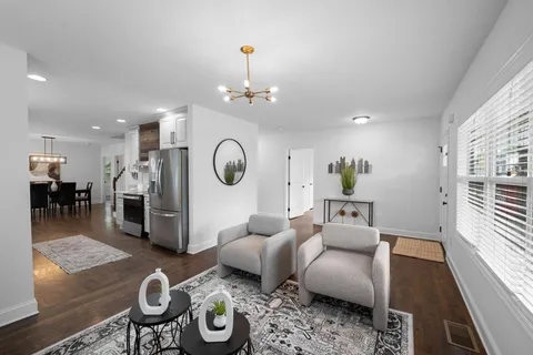 a living room with furniture and a table