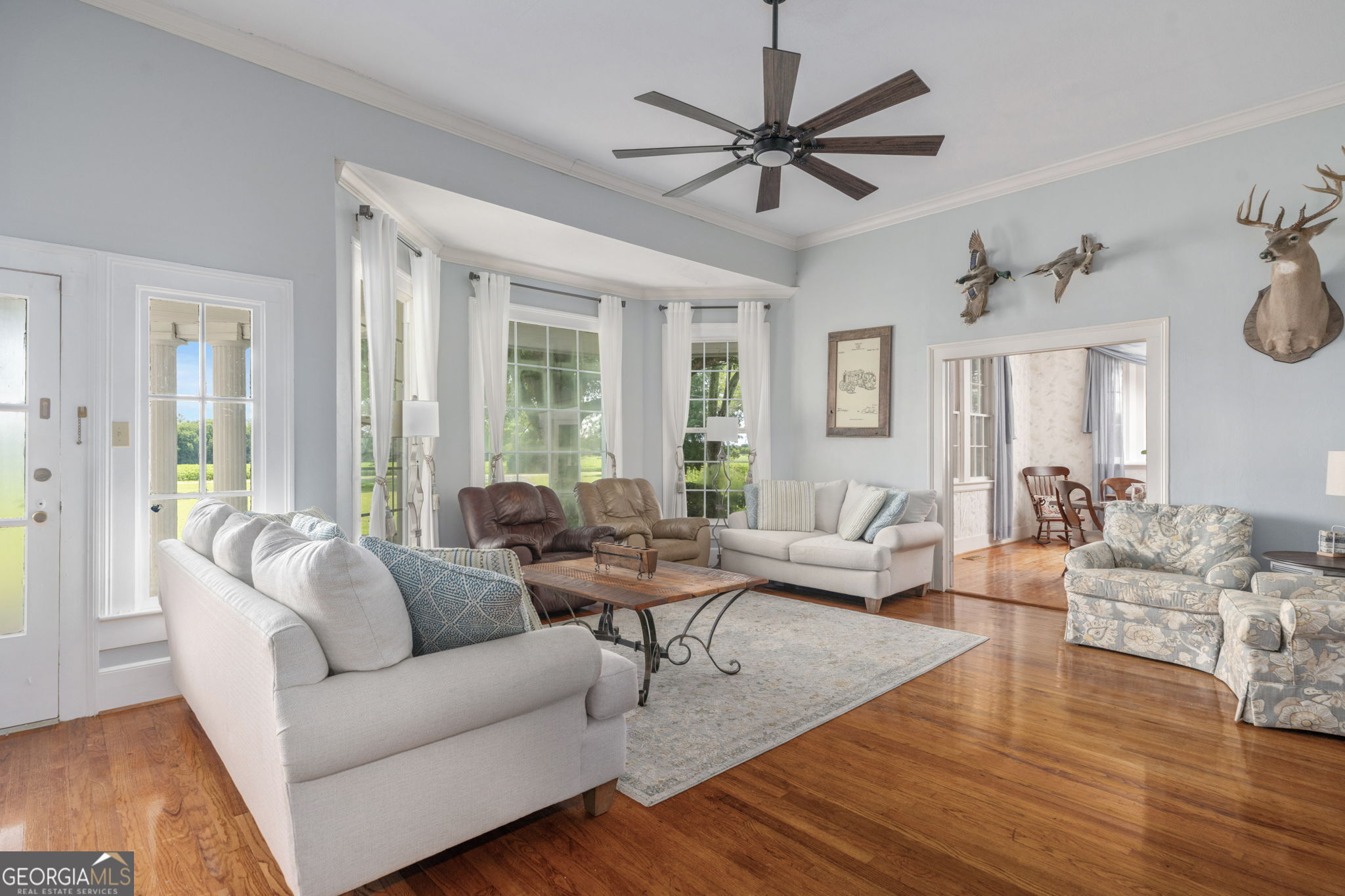 7890 Poplar Springs Road Byromville, GA 31007 - Photo 11 of 74 a living room with furniture and a large window