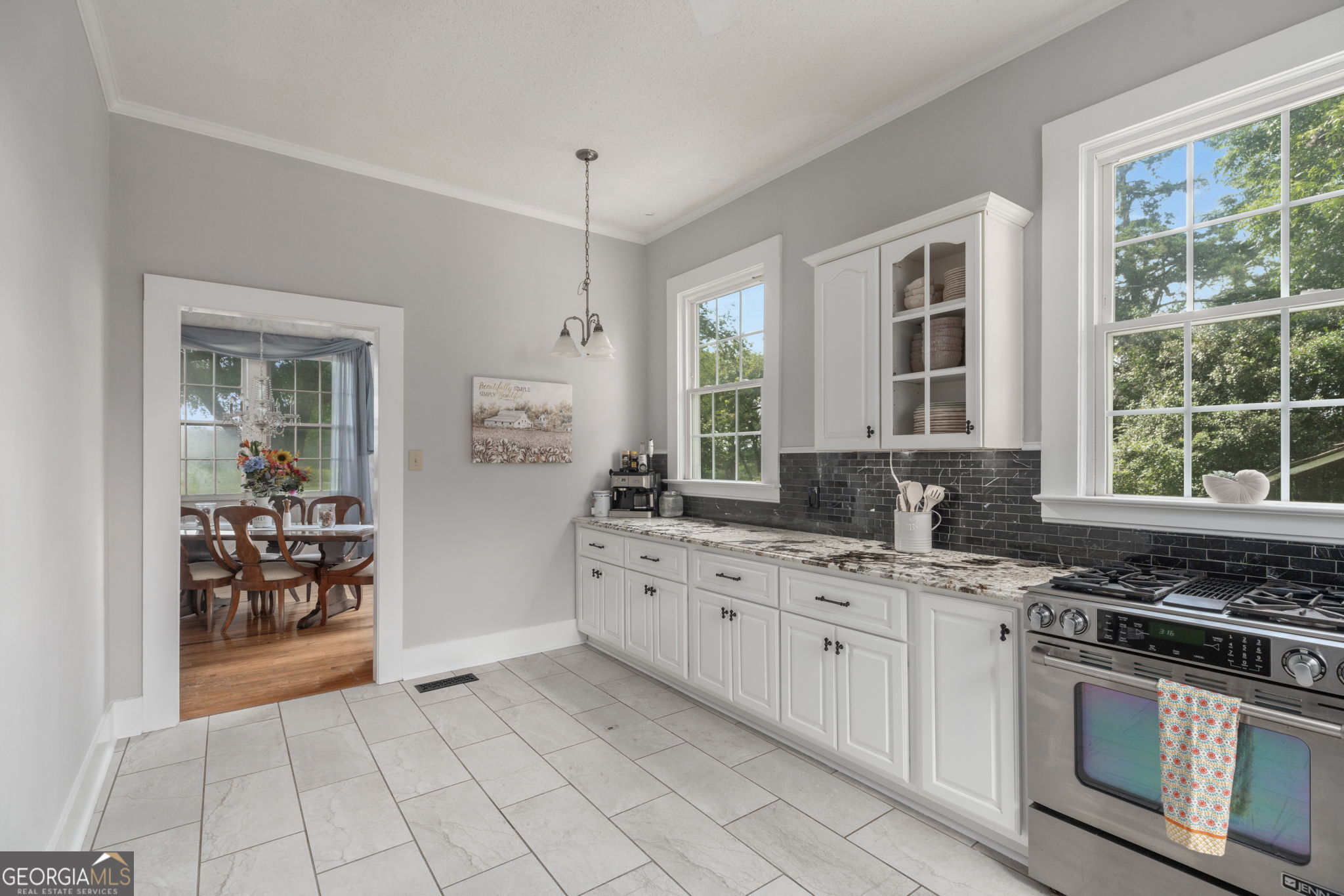 7890 Poplar Springs Road Byromville, GA 31007 - Photo 18 of 74 a kitchen with stainless steel appliances a stove sink and microwave