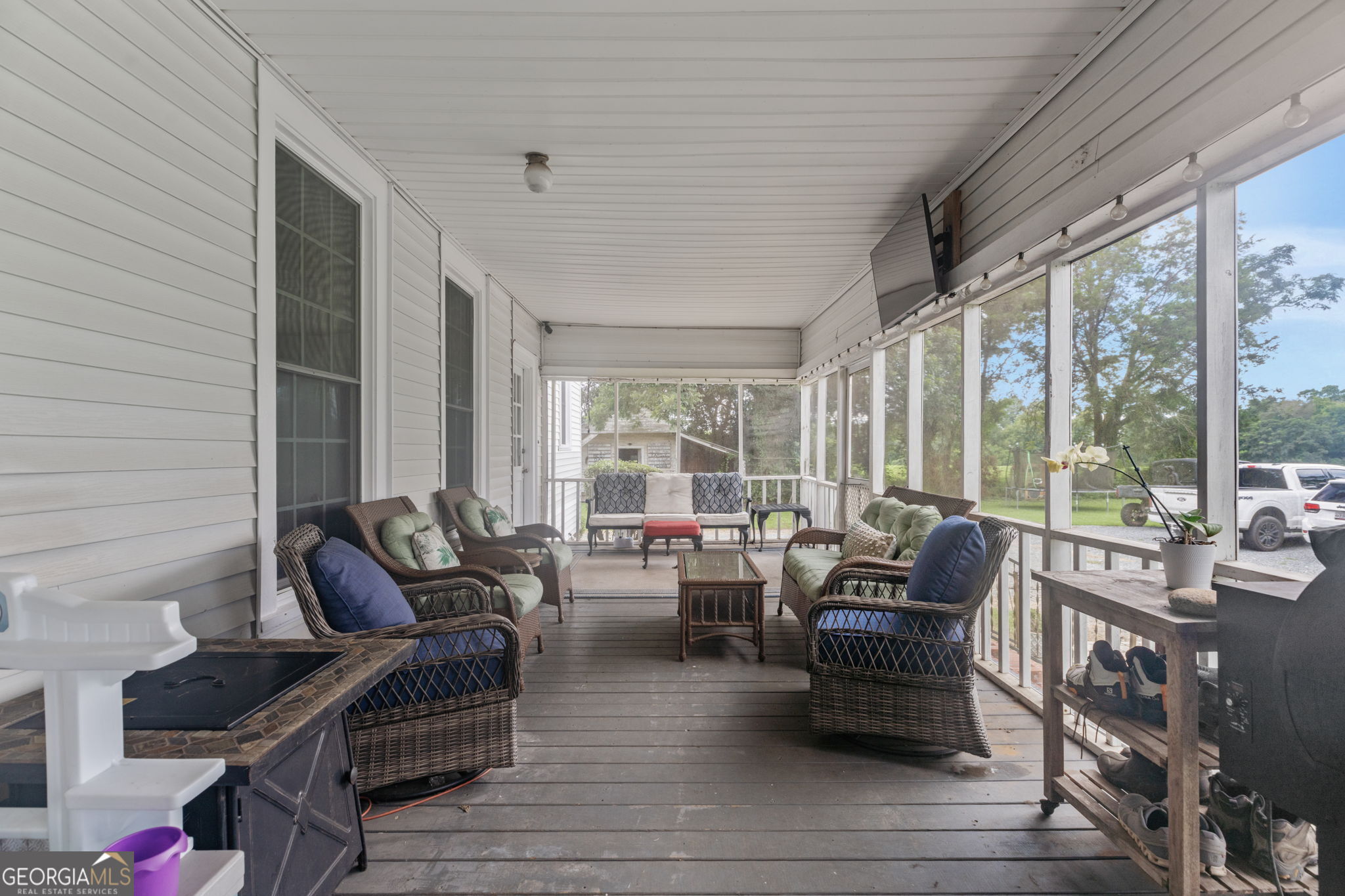 7890 Poplar Springs Road Byromville, GA 31007 - Photo 21 of 74 a living room with furniture and floor to ceiling windows