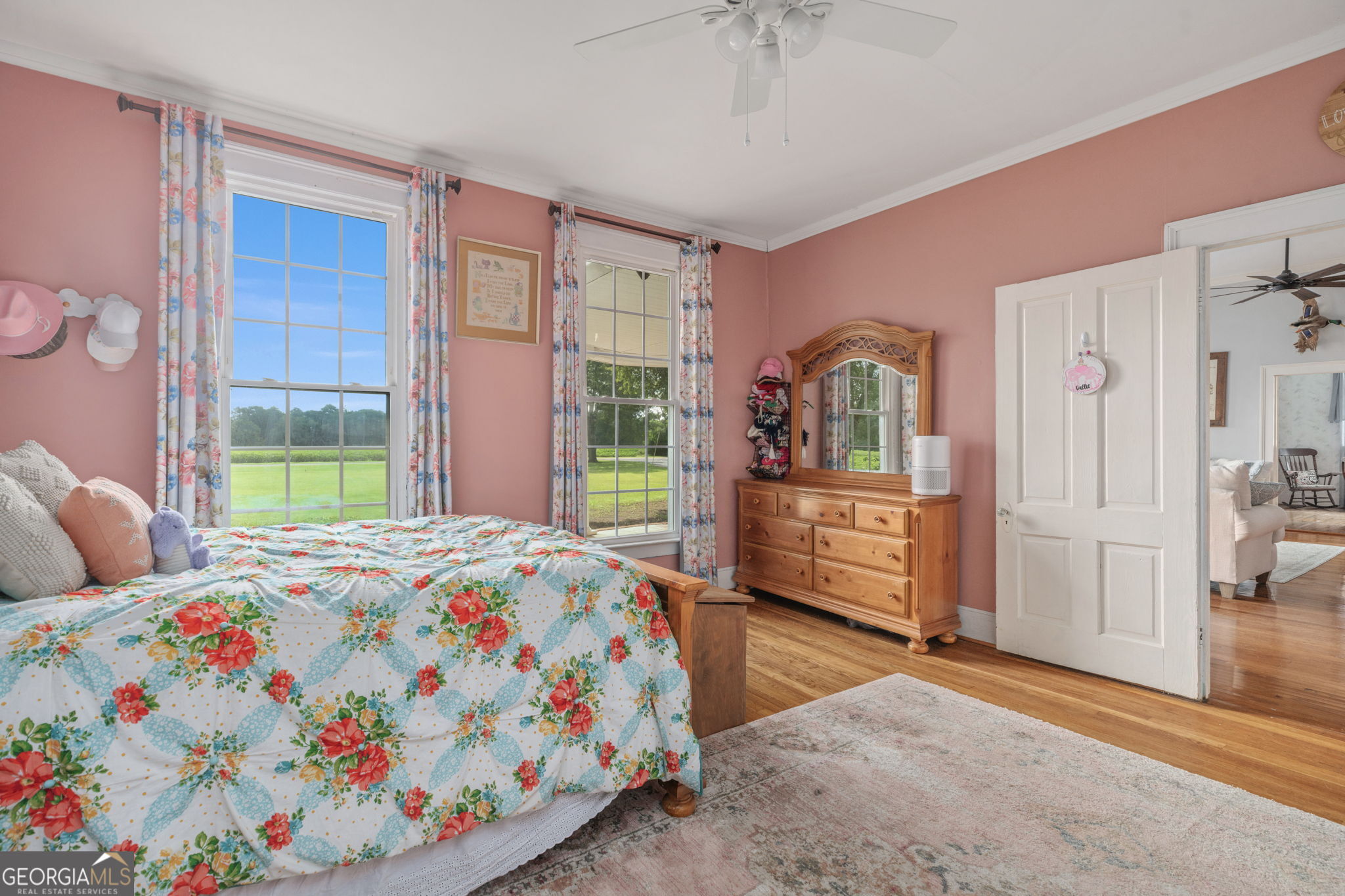 7890 Poplar Springs Road Byromville, GA 31007 - Photo 23 of 74 a bedroom with a bed and wooden floor