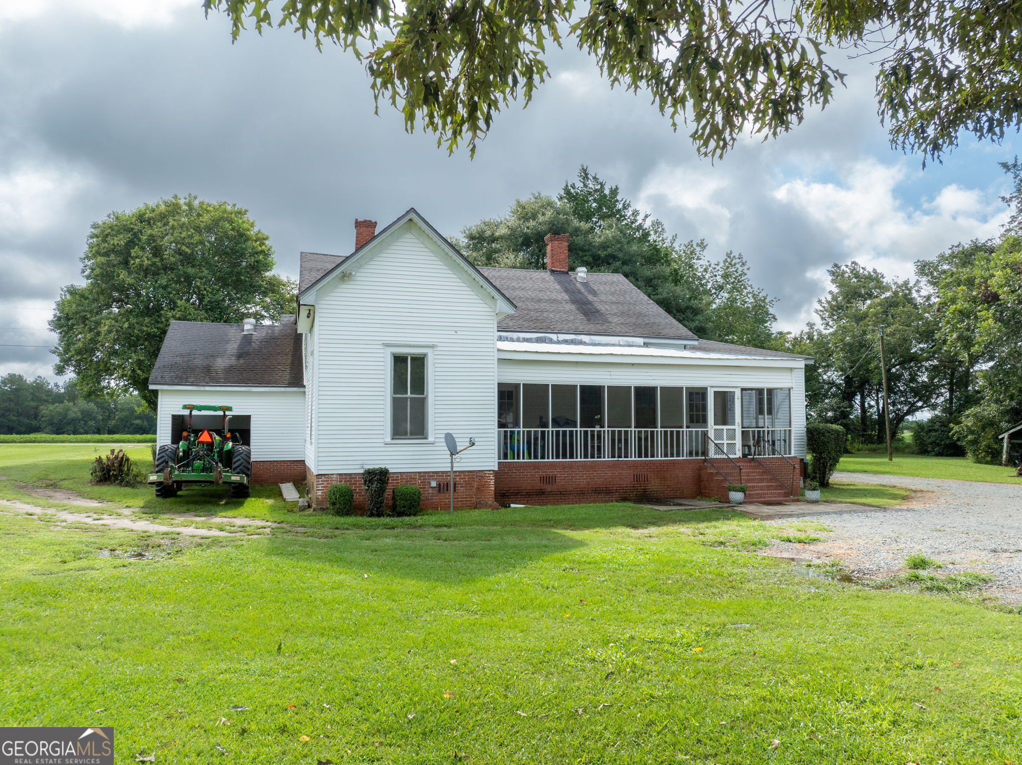 7890 Poplar Springs Road Byromville, GA 31007 - Photo 34 of 74 a view of a house with a yard and sitting area