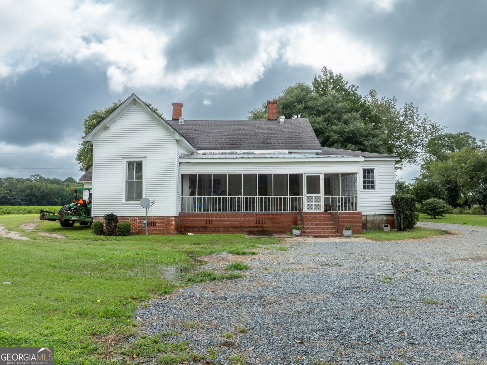 7890 Poplar Springs Road Byromville, GA 31007 - Photo 36 of 74 a view of a house with a yard and sitting area