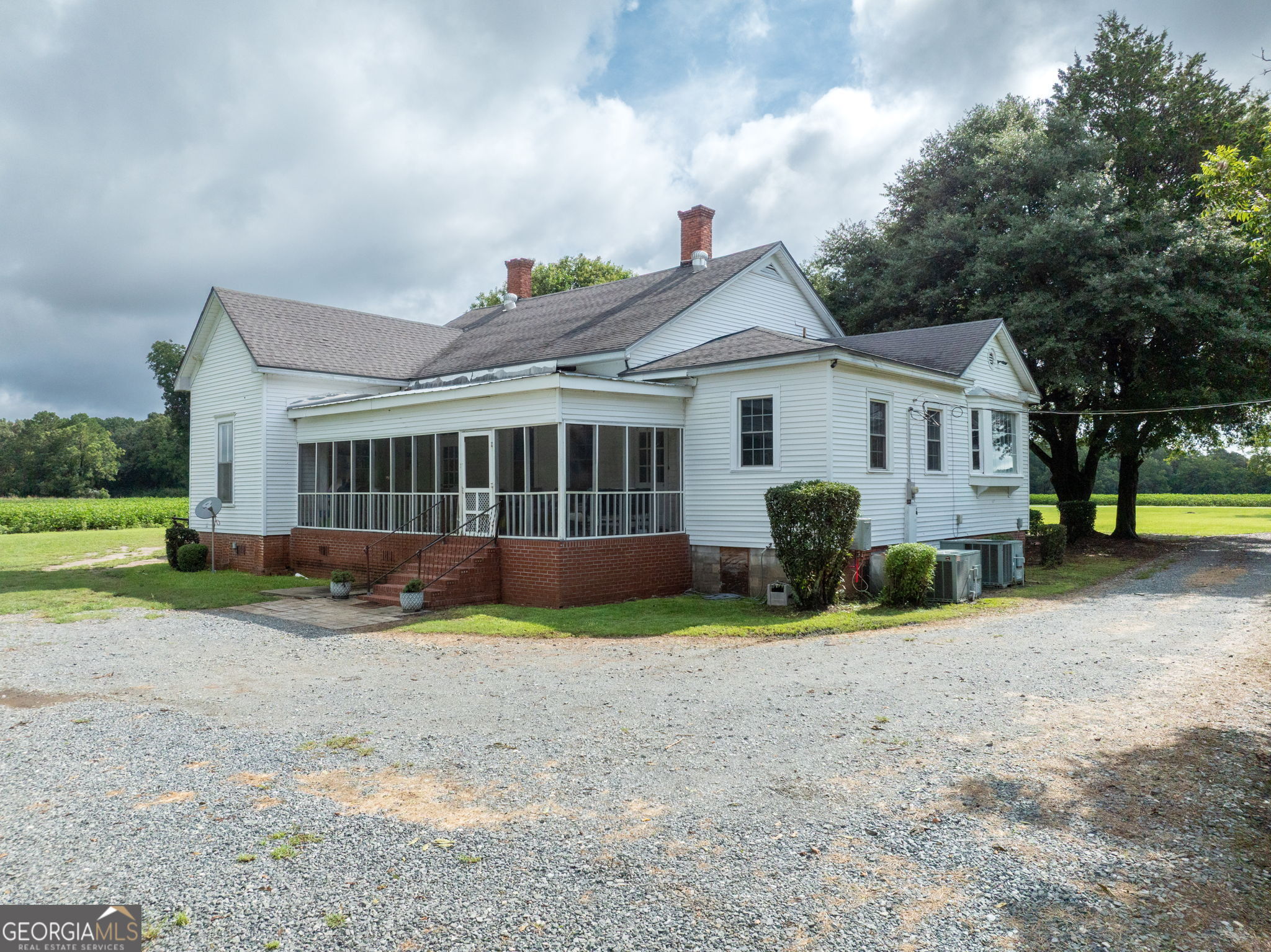 7890 Poplar Springs Road Byromville, GA 31007 - Photo 39 of 74 a view of a house with a yard and a large tree