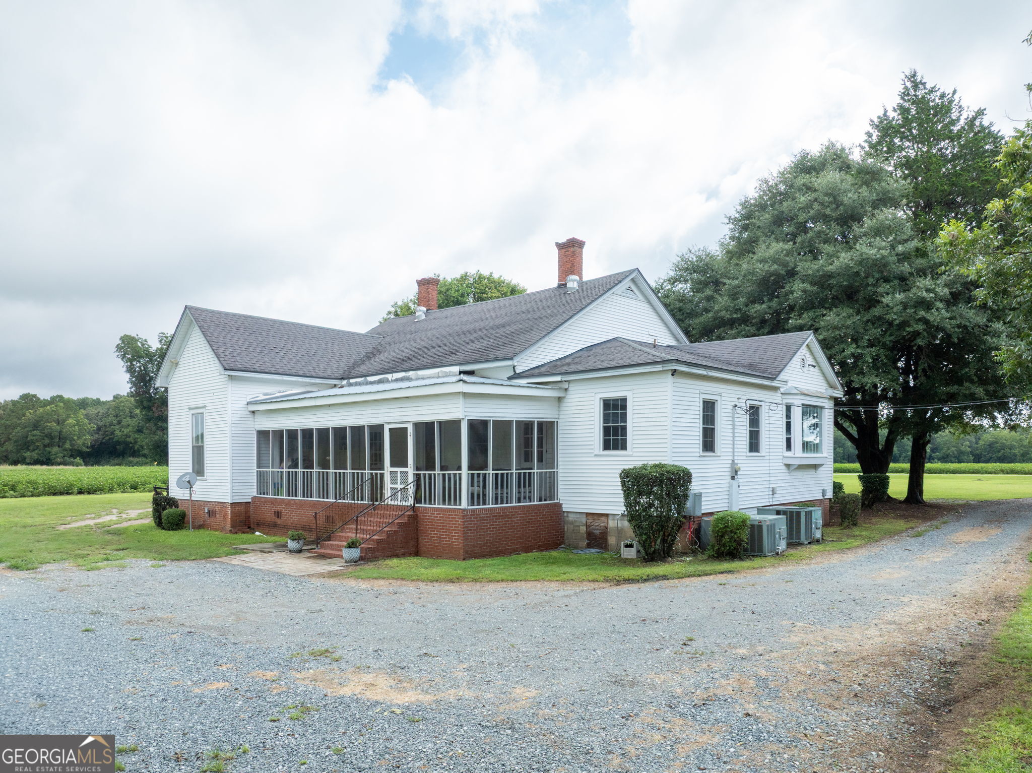 7890 Poplar Springs Road Byromville, GA 31007 - Photo 40 of 74 a view of a house with a yard and large tree