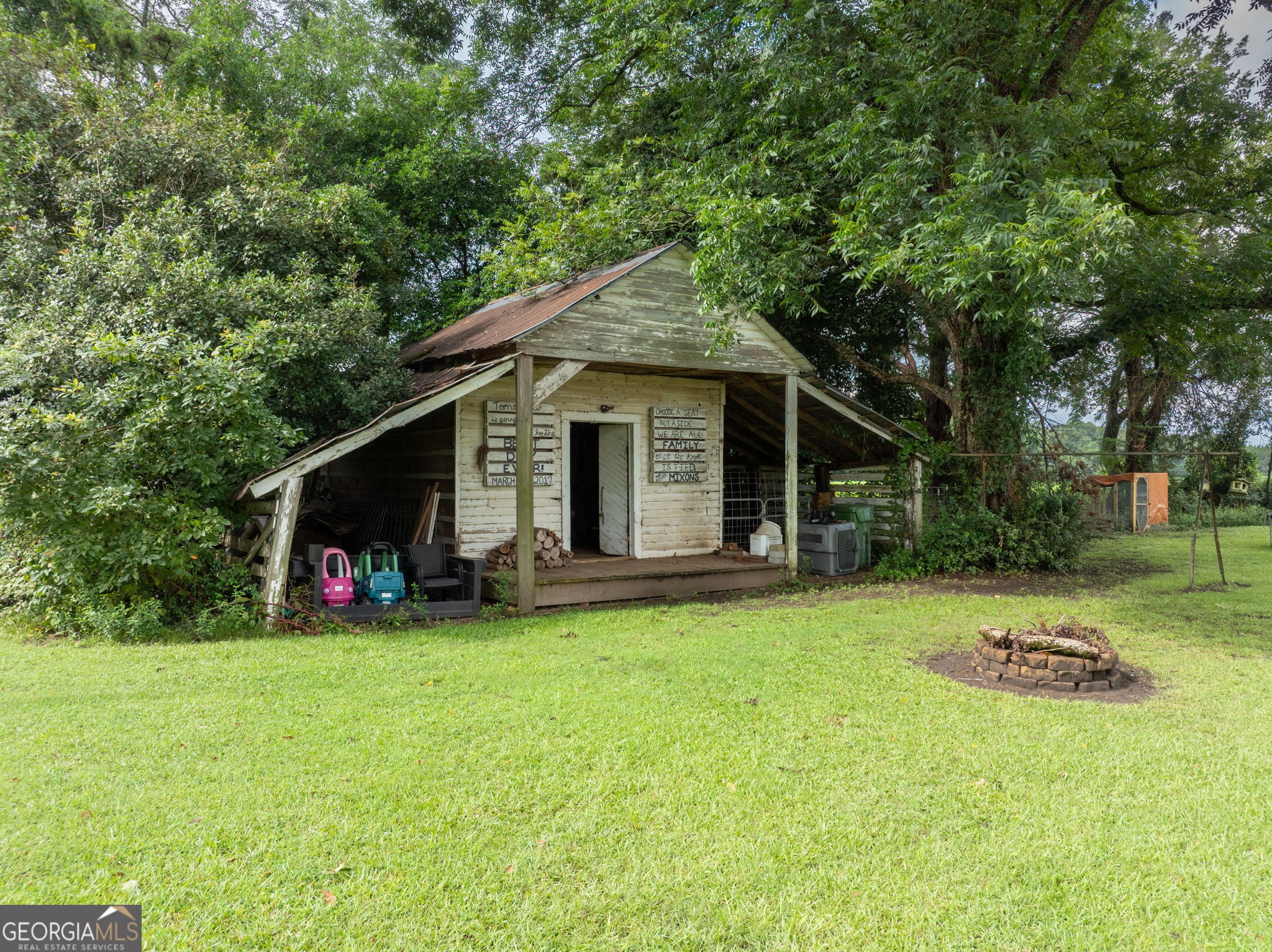 7890 Poplar Springs Road Byromville, GA 31007 - Photo 41 of 74 a view of a house with yard and sitting area