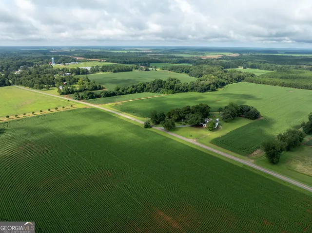 a view of a lake with a yard