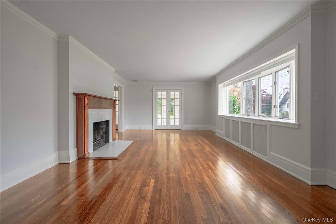 62 Summit Avenue Bronxville, NY 10708 - Photo 5 of 24 Living Room w/Fpl. and doors to enclosed Porch