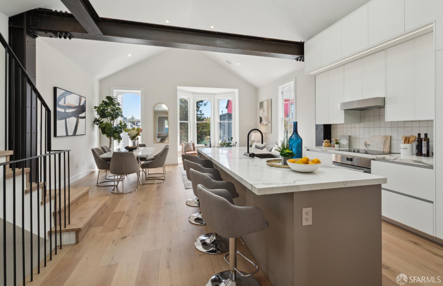 a kitchen with sink refrigerator and stove