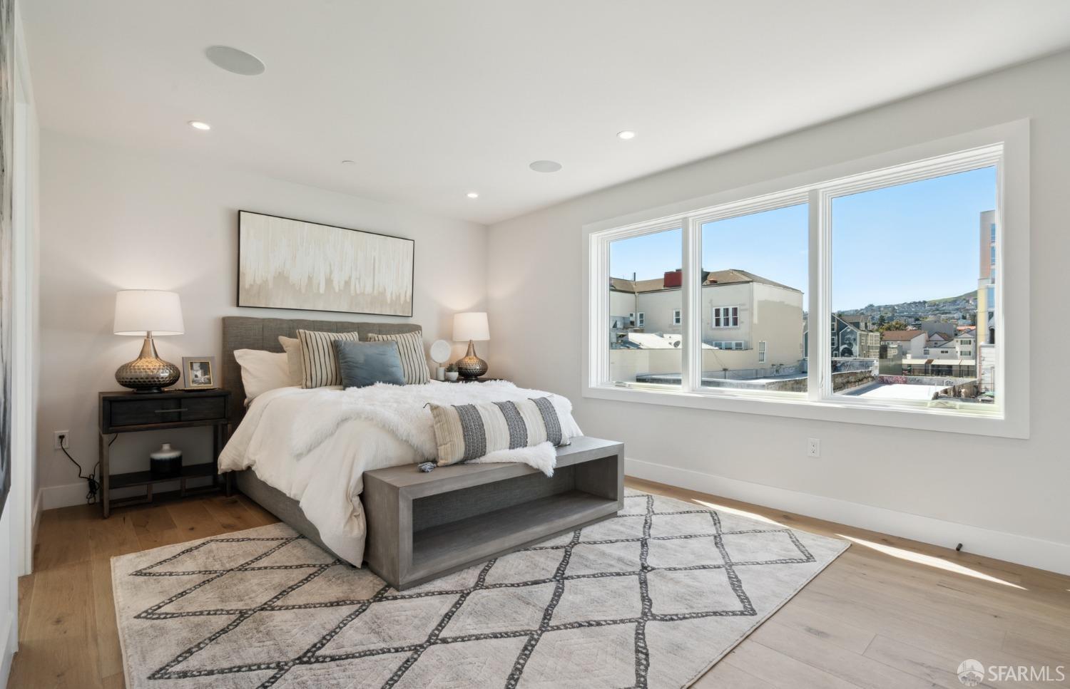 674 Capp Street San Francisco, CA 94110 - Photo 24 of 41 a bedroom with a bed and window