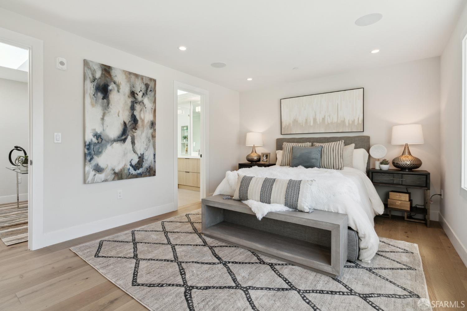 674 Capp Street San Francisco, CA 94110 - Photo 25 of 41 a bedroom with a bed and a painting on the wall