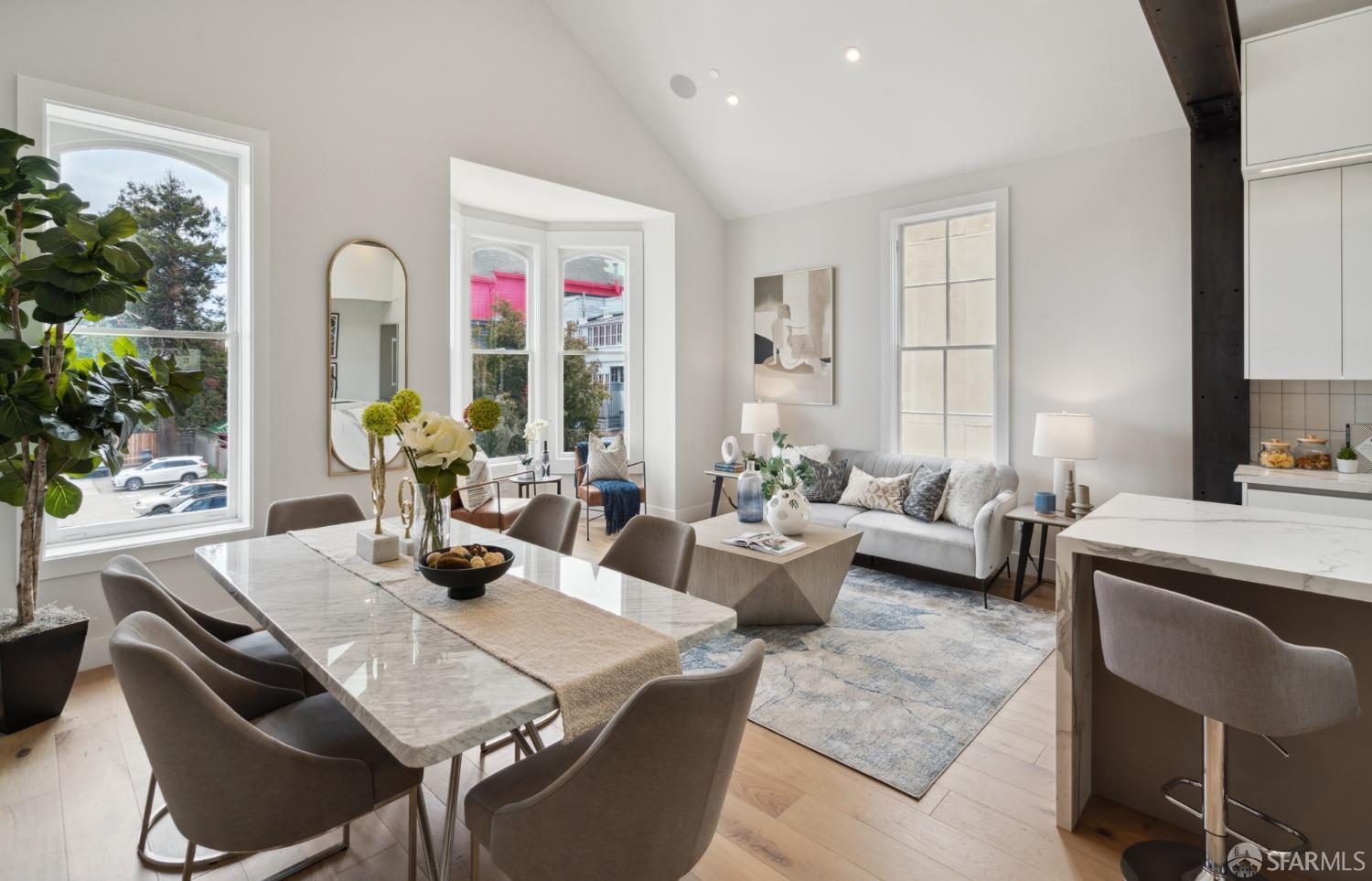 674 Capp Street San Francisco, CA 94110 - Photo 3 of 41 a living room with furniture kitchen view and a large window
