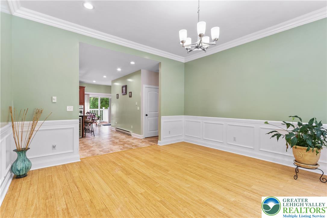 1007 Hampstead Road Bushkill, PA 18324 - Photo 13 of 72 Bright bamboo flooring creates a warm, inviting atmosphere in this main living area.
