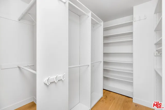 a view of a room with shelf on the wall