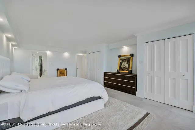 a bedroom with a bed and a walk in closet