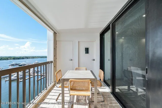 a view of a balcony with wooden floor