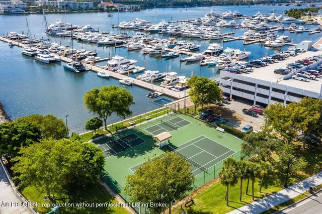 a view of a lake with lawn chairs