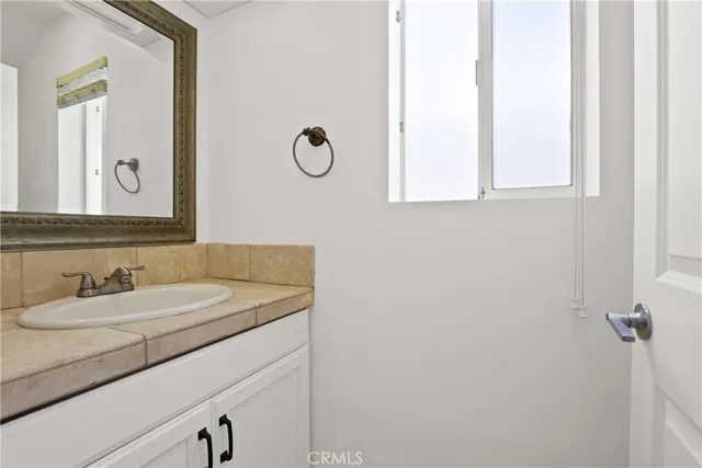 a view of bathroom with baby crib