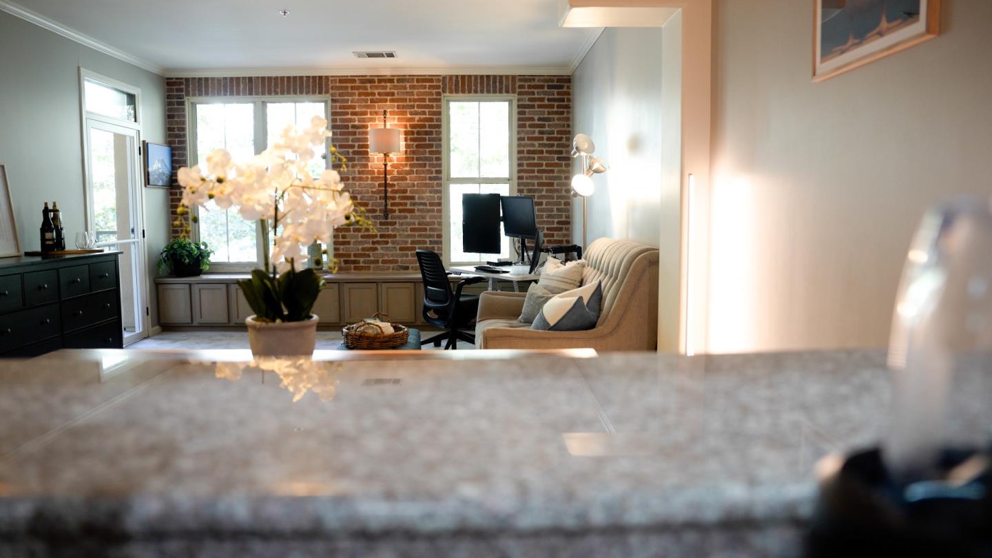 30 East Julian Street, Unit 307 San Jose, CA 95112 - Photo 12 of 24 a view of livingroom with furniture and windows