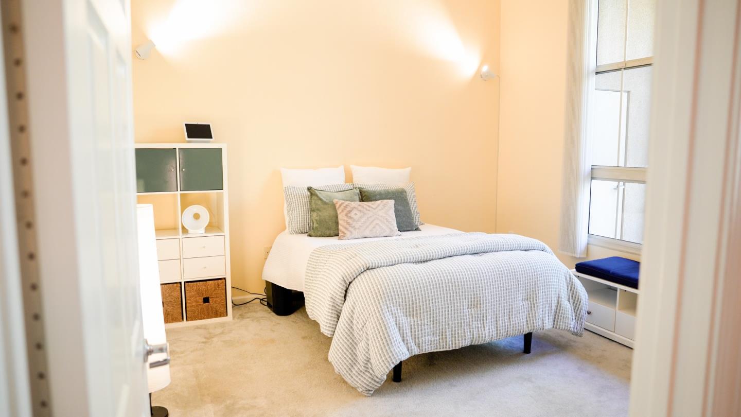 30 East Julian Street, Unit 307 San Jose, CA 95112 - Photo 14 of 24 a bedroom with a bed and a window