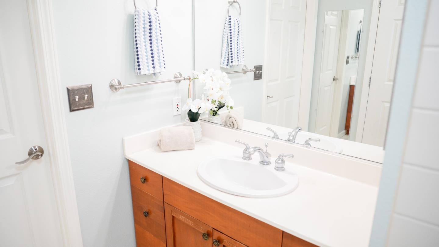 30 East Julian Street, Unit 307 San Jose, CA 95112 - Photo 18 of 24 a bathroom with a sink and a mirror