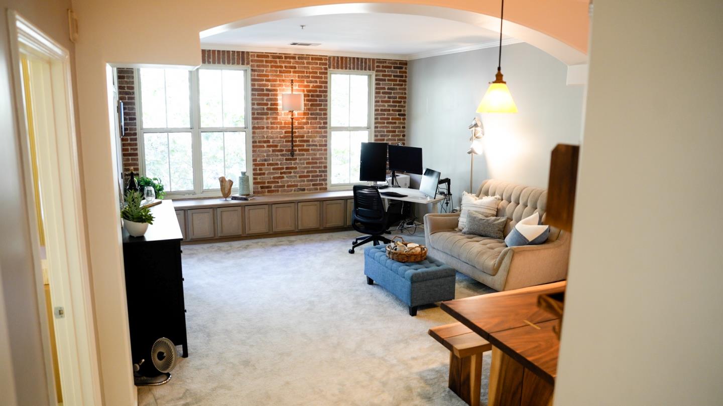 30 East Julian Street, Unit 307 San Jose, CA 95112 - Photo 2 of 24 a livingroom with workspace and a window