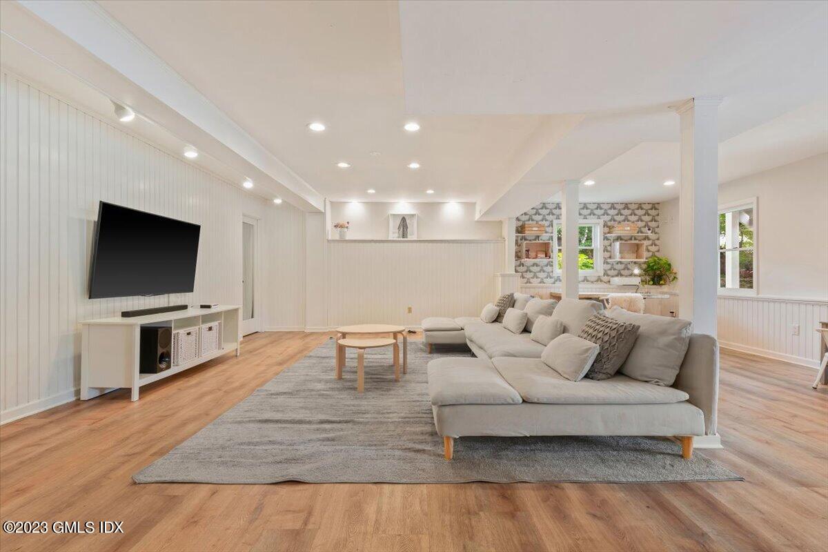 5 Sunshine Avenue Riverside, CT 06878 - Photo 27 of 35 a living room with furniture and a flat screen tv