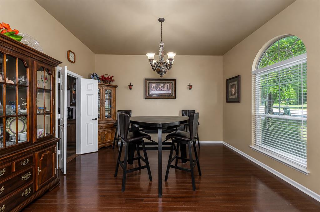 100 Manders Court Runaway Bay, TX 76426 - Photo 16 of 33 a view of a dining room with furniture window and wooden floor