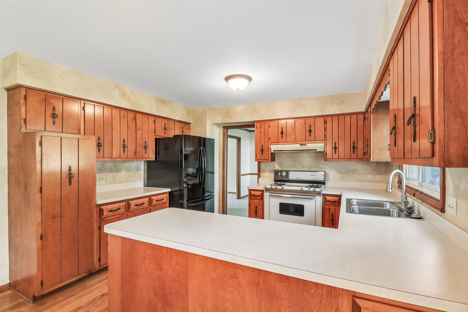 733 Buttonwood Circle Naperville, IL 60540 - Photo 16 of 39 a kitchen with stainless steel appliances granite countertop a refrigerator stove and sink