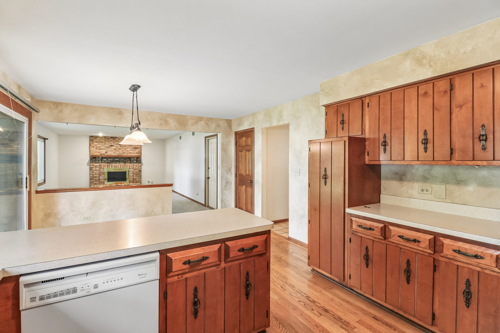 733 Buttonwood Circle Naperville, IL 60540 - Photo 17 of 39 a kitchen with stainless steel appliances granite countertop a refrigerator a sink dishwasher a stove and white countertops with wooden floor