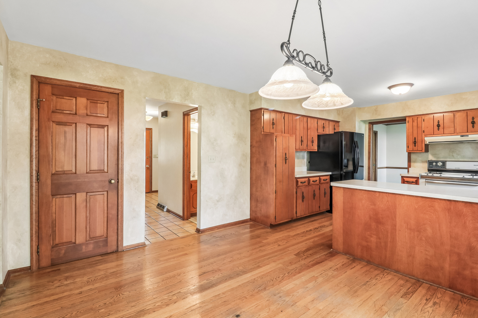 733 Buttonwood Circle Naperville, IL 60540 - Photo 19 of 39 a kitchen with stainless steel appliances granite countertop a refrigerator oven a sink dishwasher and a refrigerator with wooden floor