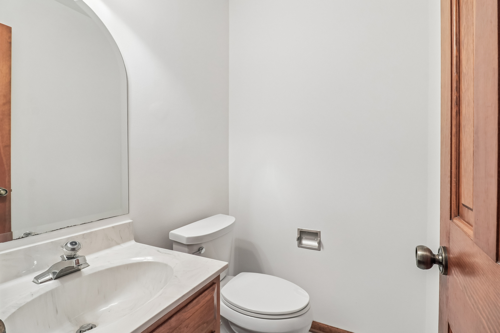733 Buttonwood Circle Naperville, IL 60540 - Photo 20 of 39 a white toilet sitting next to a bathroom sink