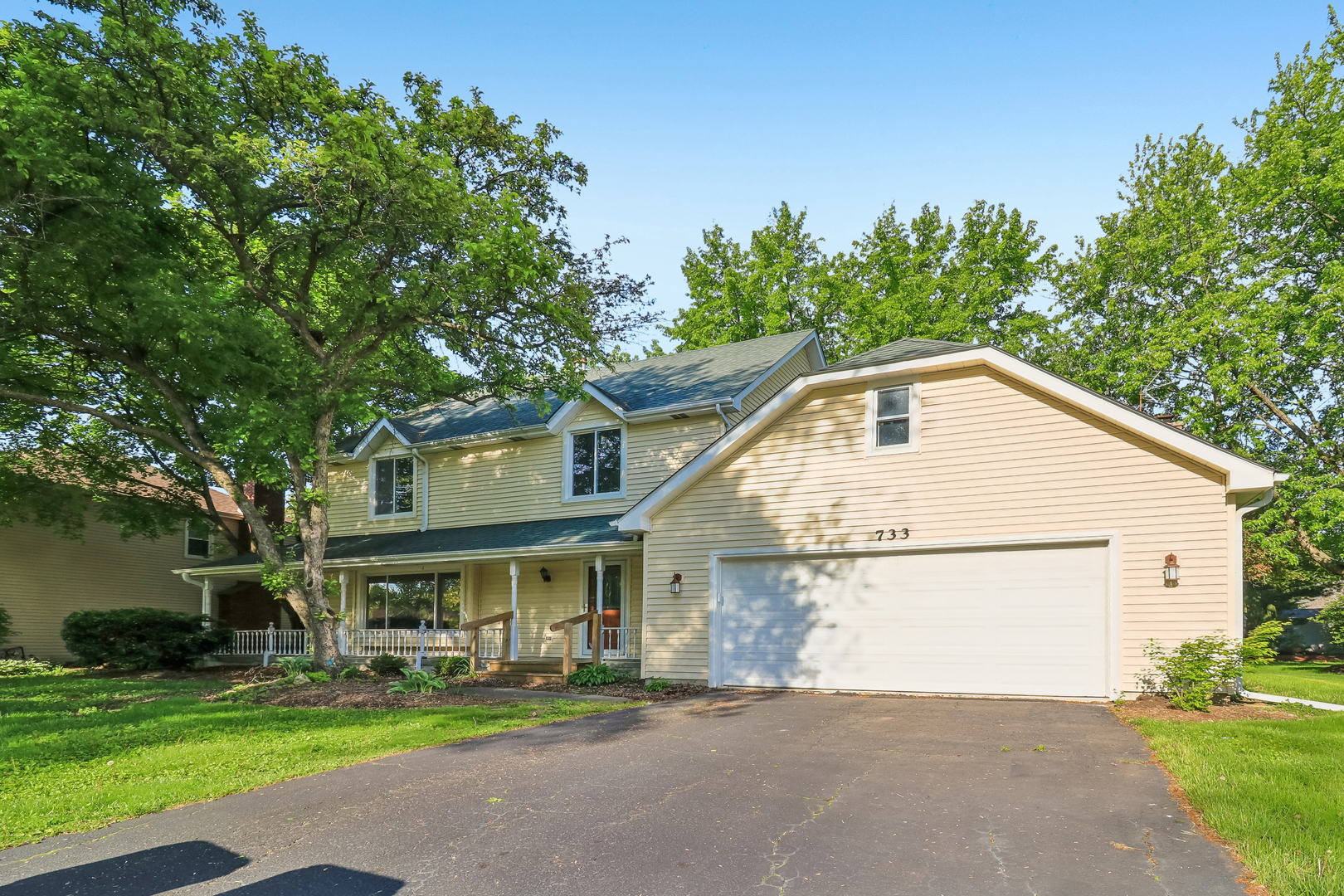 733 Buttonwood Circle Naperville, IL 60540 - Photo 29 of 39 a front view of a house with a yard and trees