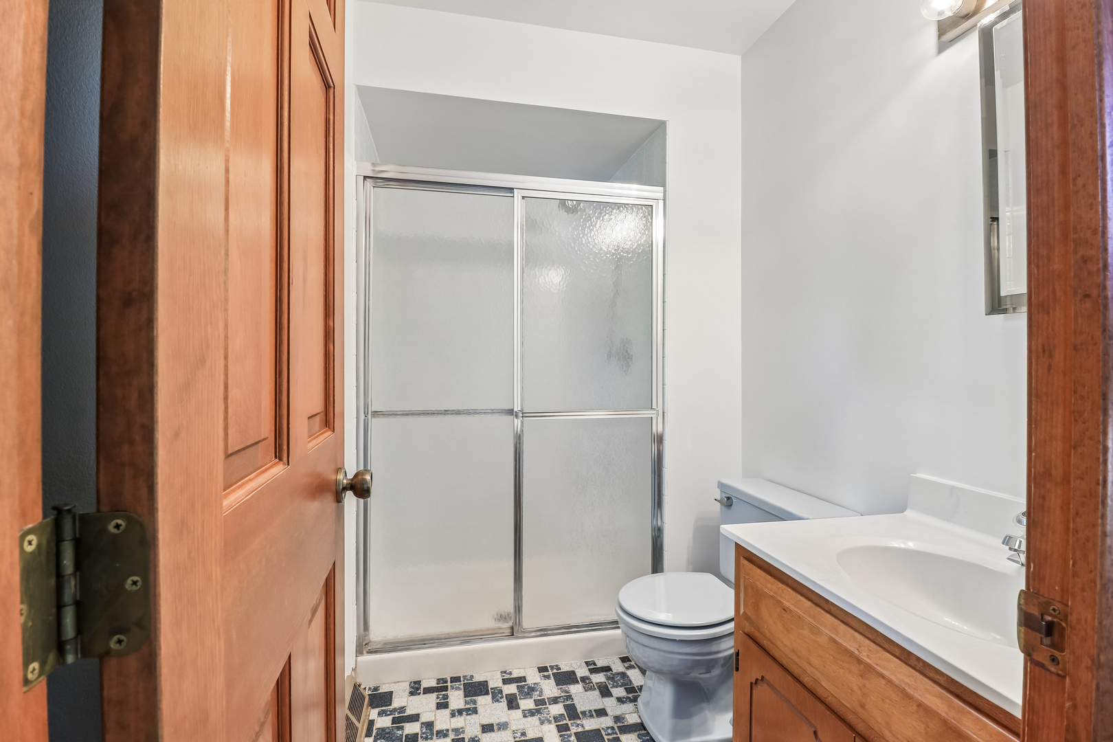 733 Buttonwood Circle Naperville, IL 60540 - Photo 37 of 39 a white toilet sitting next to a bathroom sink