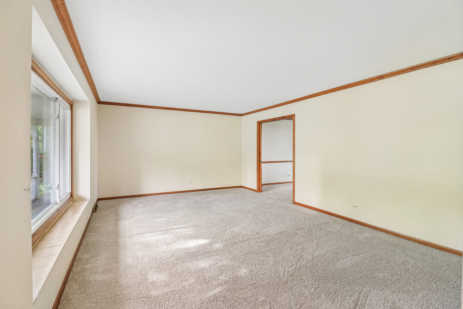 733 Buttonwood Circle Naperville, IL 60540 - Photo 8 of 39 a view of an empty room with a window