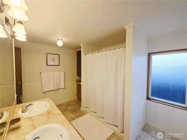 a bathroom with a sink and shower