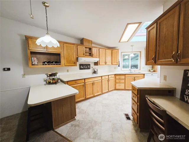 a very nice looking kitchen with a large window