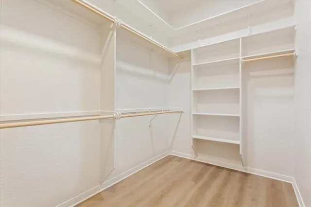 a view of an empty walk in closet