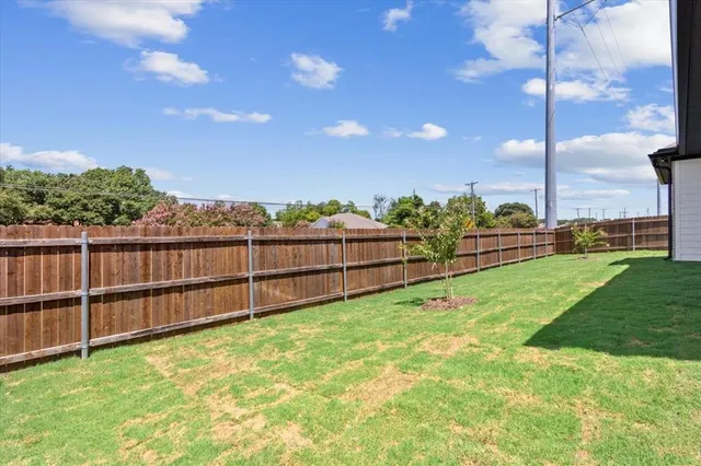 a view of a backyard with hardwood