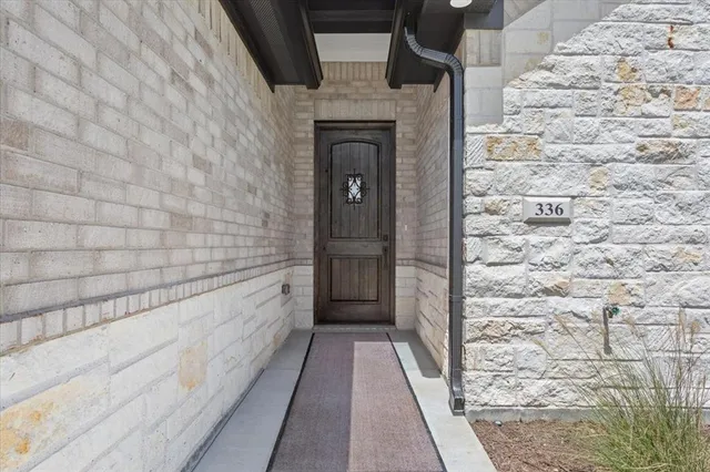 a view of a door and wooden floor