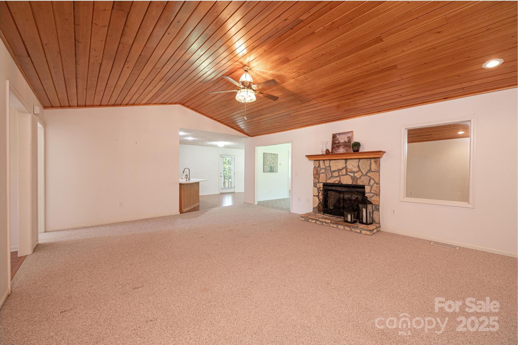 227 Robert Keever Road Stanley, NC 28164 - Photo 16 of 45 a view of empty room with furniture and fireplace