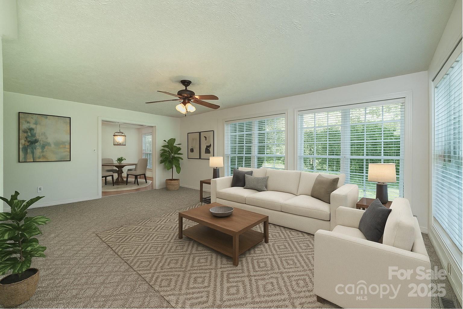 227 Robert Keever Road Stanley, NC 28164 - Photo 21 of 45 a living room with furniture and a large window
