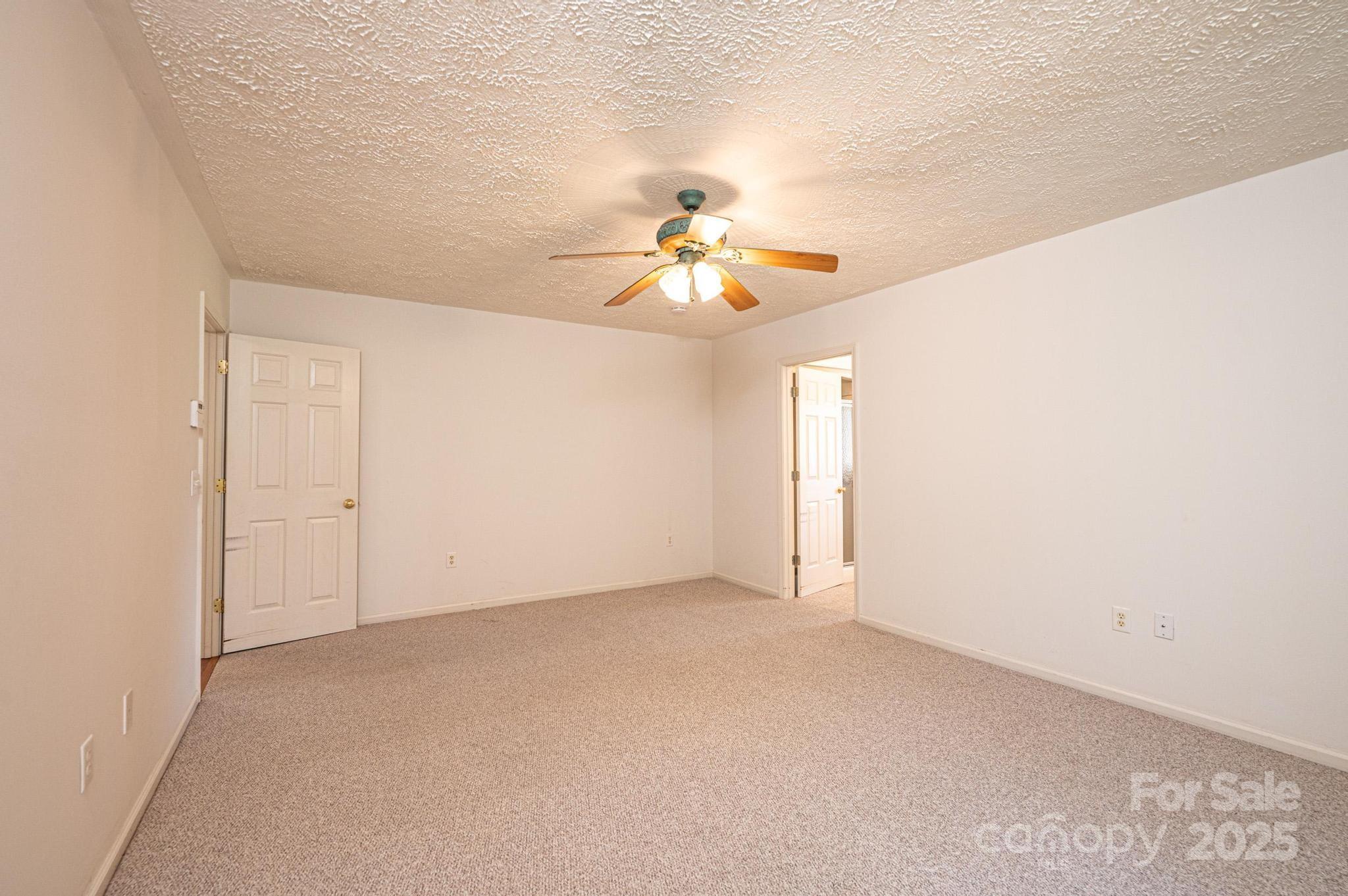 227 Robert Keever Road Stanley, NC 28164 - Photo 35 of 45 an empty room with fan and window