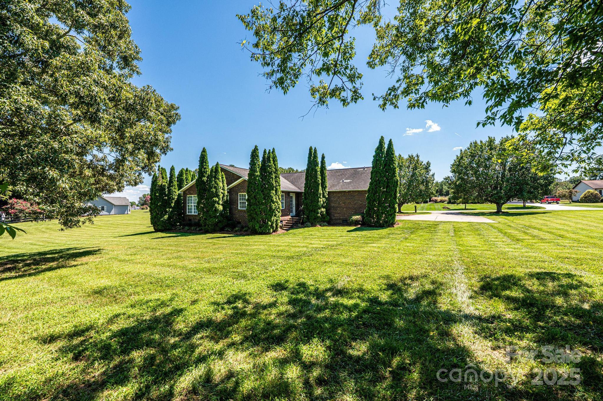 227 Robert Keever Road Stanley, NC 28164 - Photo 7 of 45 a view of an outdoor space and a yard