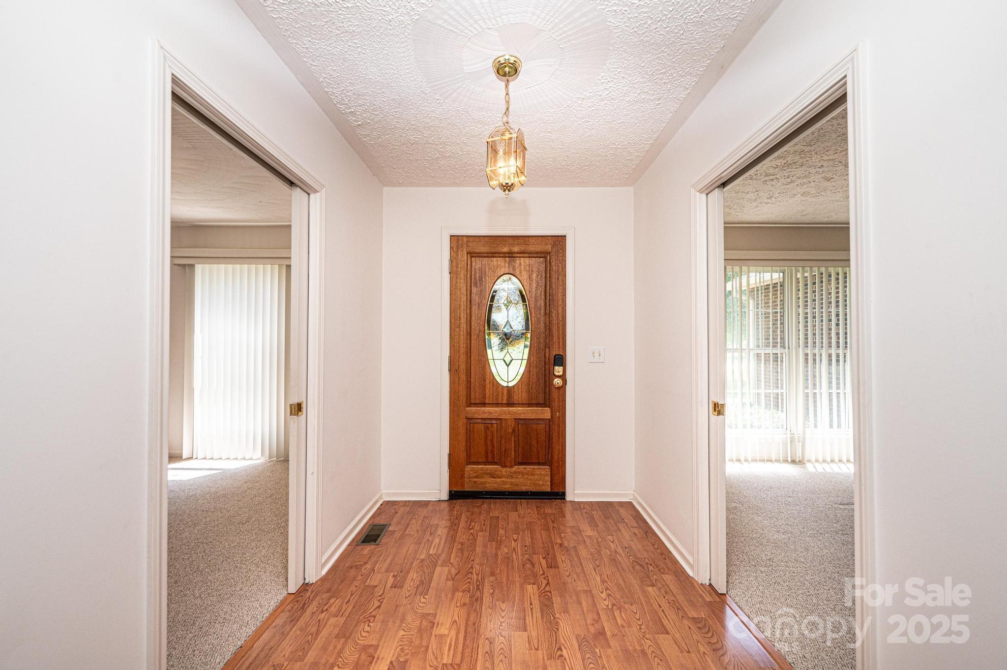 227 Robert Keever Road Stanley, NC 28164 - Photo 10 of 45 a view of entryway with wooden floor