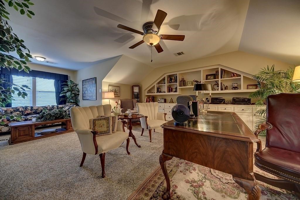 8456 Schuster Road Ledbetter, TX 78946 - Photo 27 of 49 a living room with furniture and a clock